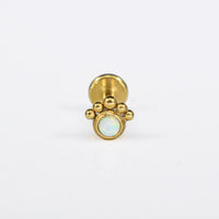 Gold steel labret with opal stone and tribal dot surround

