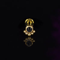 gold steel labret with black stone and curve of dots