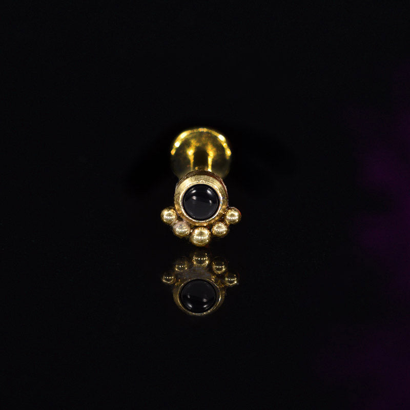 gold steel labret with black stone and curve of dots