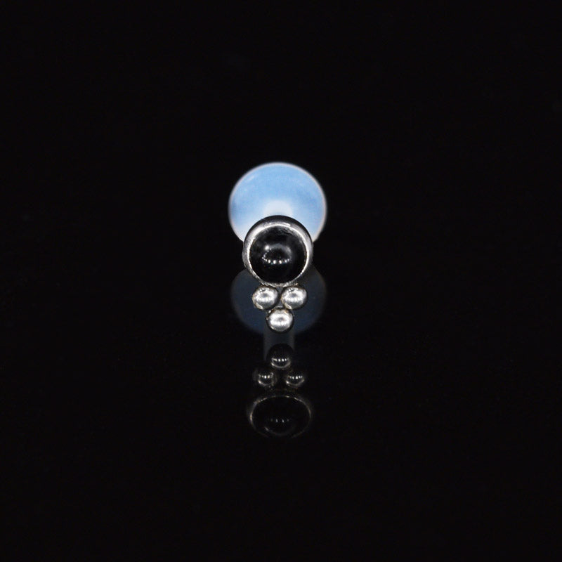 A BioFlex Labret with Onyx Stone and Triple Dots on a black background, primarily showcasing the labret with the stone.
