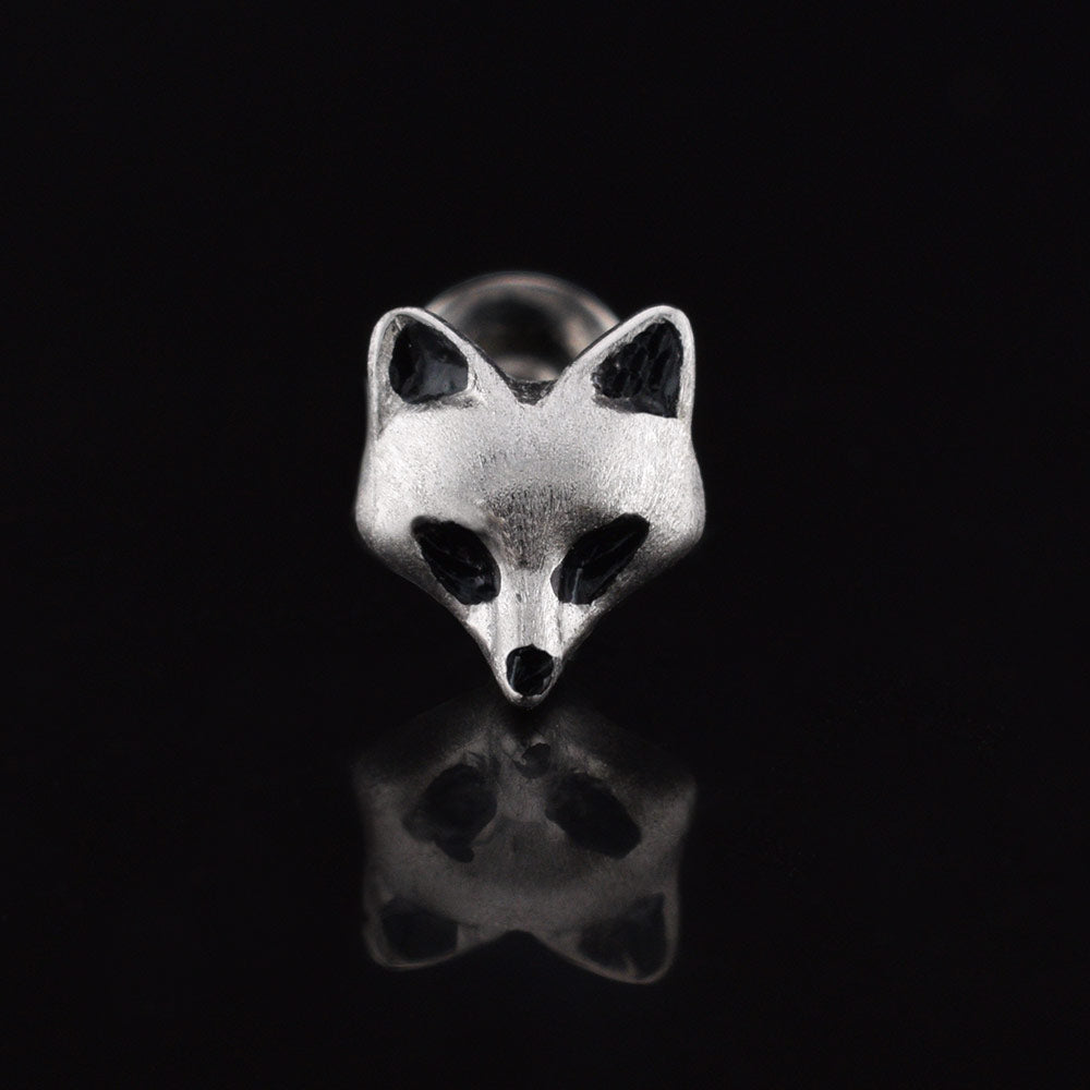 Fox face labret  jewellery stud on a black background
