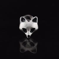 Fox face labret  jewellery stud on a black background