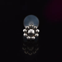 BioFlex PTFE labret stud with tribal dotdesign on a balck background