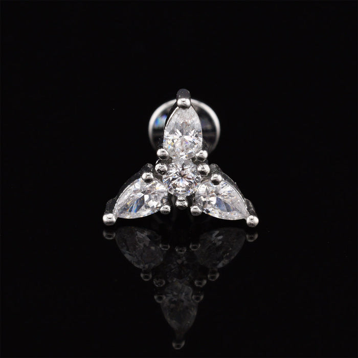 A silver-tone triquetra cluster labret stud earring featuring three marquise-cut clear stones and a round center stone, displayed on a reflective black surface.