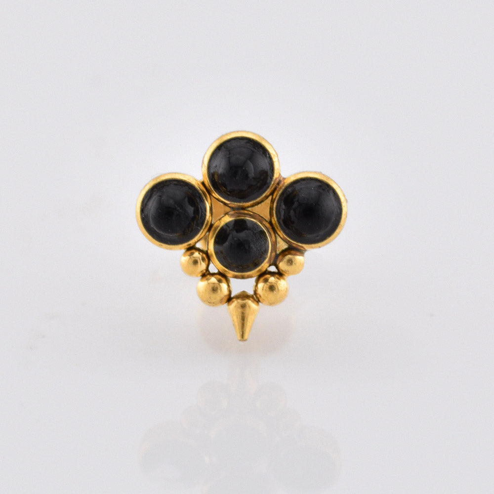 gold steel labret stud jewellery with four black onyx stones, tribal beads and a drop spike on a white background