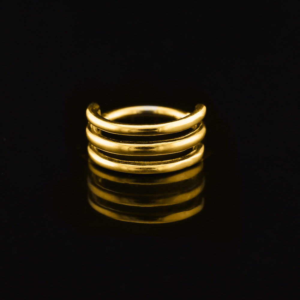 triple hoop segment clicker ring in gold steel