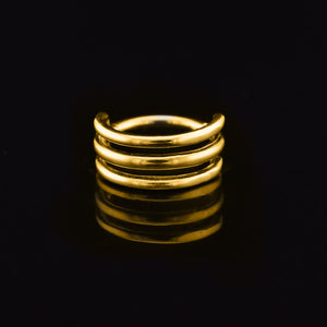 triple hoop segment clicker ring in gold steel