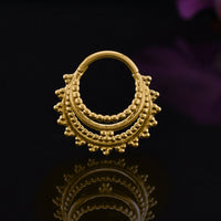 gold clicker ring in a tribal indian design, surgical steel hinged segment ring