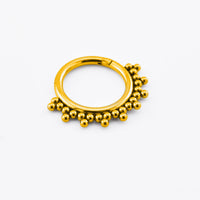 gold segment clicker ring in steel for ear piercings with tribal beads design