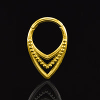 Tribal Triple V shape clicker ring in gold surgical steel on a black background
