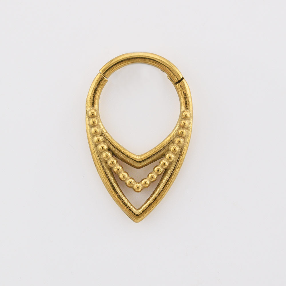 V shape clicker ring, tribal design, in gold surgical steel on white background