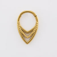 V shape clicker ring, tribal design, in gold surgical steel on white background