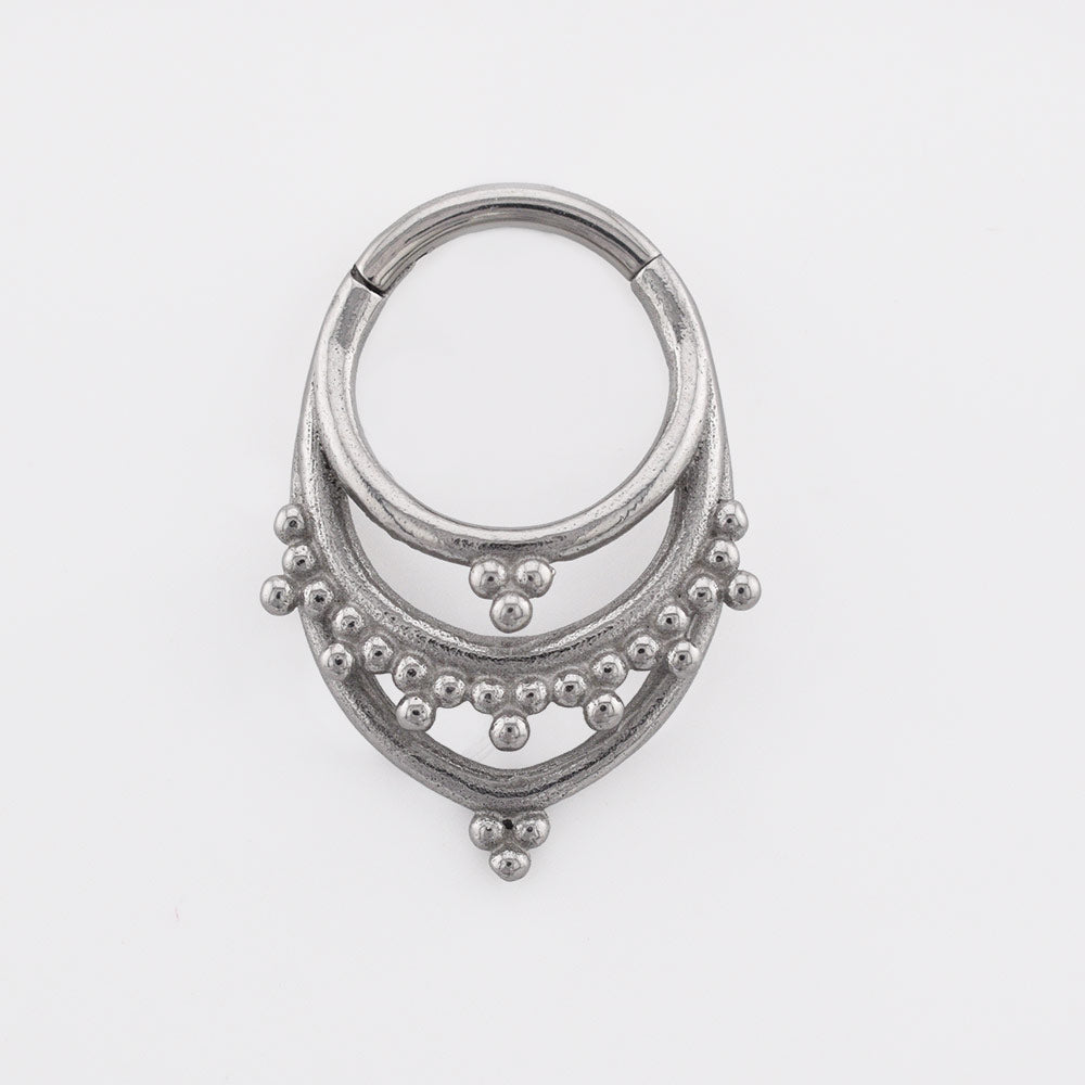 Tribal Clicker RIng aka hinged segment piercing ring in an Indian design on a white background