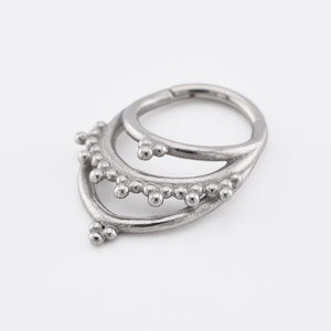 Tribal Clicker RIng aka hinged segment piercing ring with triple hoops and tribal dots in an Indian design on a white background