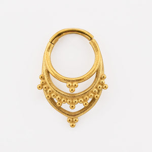Indian Tribal Segment Clicker Ring in Gold Steel on a white backgound