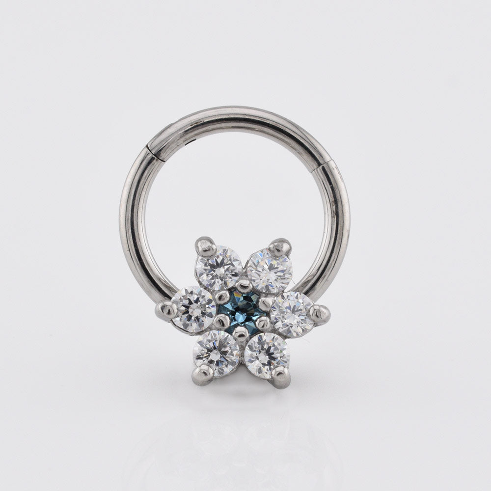 hinged segment clicker earring with flower design in CZ crystals on a white background