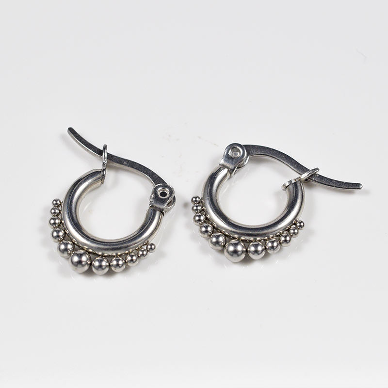 small tribal style earrings dotted hoops in surgical steel