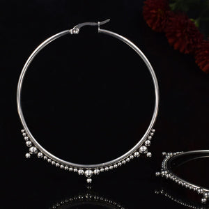 Big large silver steel hoop earrings with tribal dot design