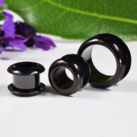 flesh tunnel black steel rivet design