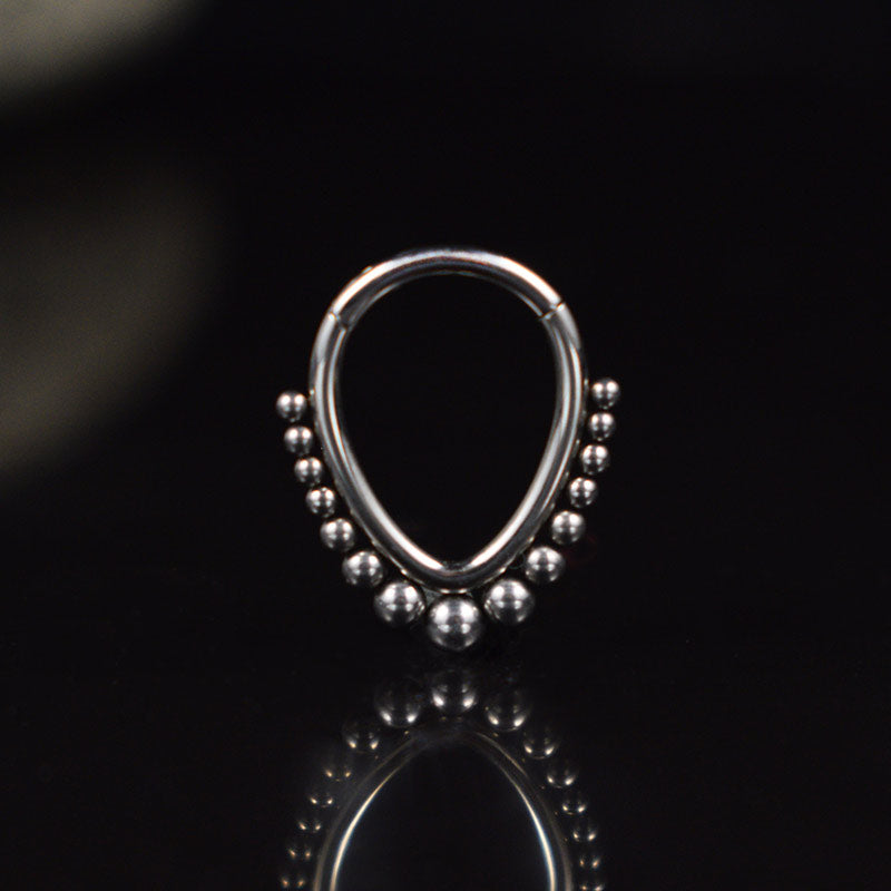 teardrop hinged segment ring with tribal dots