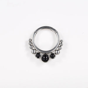 hinged segment ring with black onyx stones