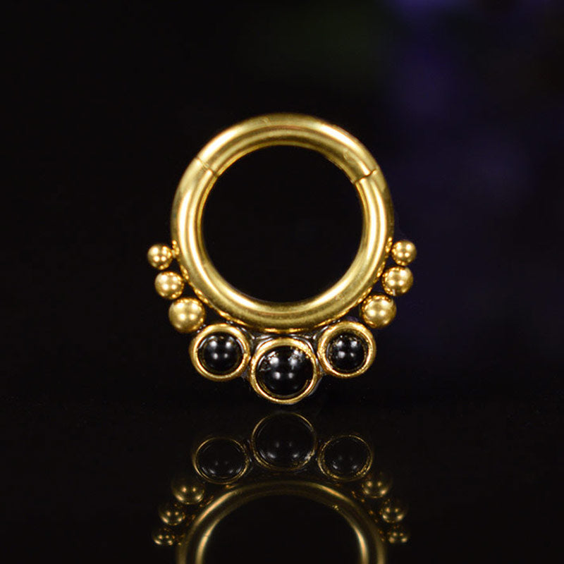 gold pvd segment ring with black onyx stones piercing ring